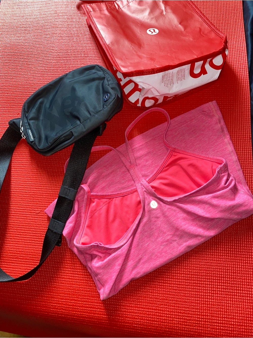 Bundle Lululemon crossbody belt bag and pink tank top size 6 with a red tote bag